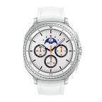 Samsung Galaxy Watch8 Classic White on wireless charging puck with charging animation.