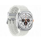 Top‑down view of Samsung Galaxy Watch Ultra Titanium White on a rock showing dual‑frequency GPS route screen.