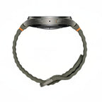 Samsung Galaxy Watch 7 44mm Green beside smartphone running Galaxy Wearable app

