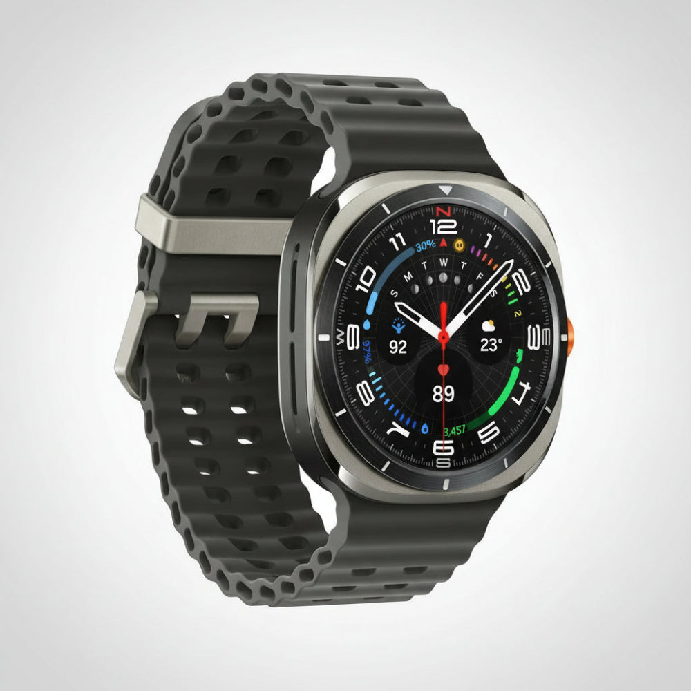 Samsung Watch Ultra 47mm Titanium Blue on a desk beside a smartphone and wireless earbuds.