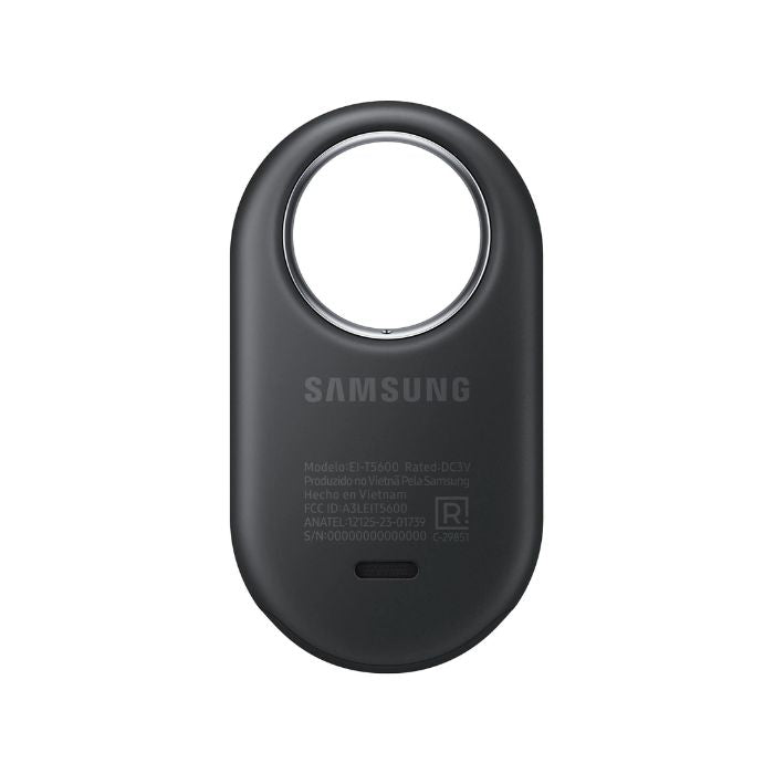 Samsung Galaxy SmartTag2 Black attached to a luggage handle in an airport setting.