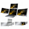 TRION QUAD TRIFOLD 15.6" folded down into compact form beside a laptop and travel bag

