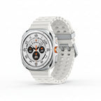 Samsung Watch Ultra 47mm Titanium White on a sandy beach with running shoes and sunglasses in frame.